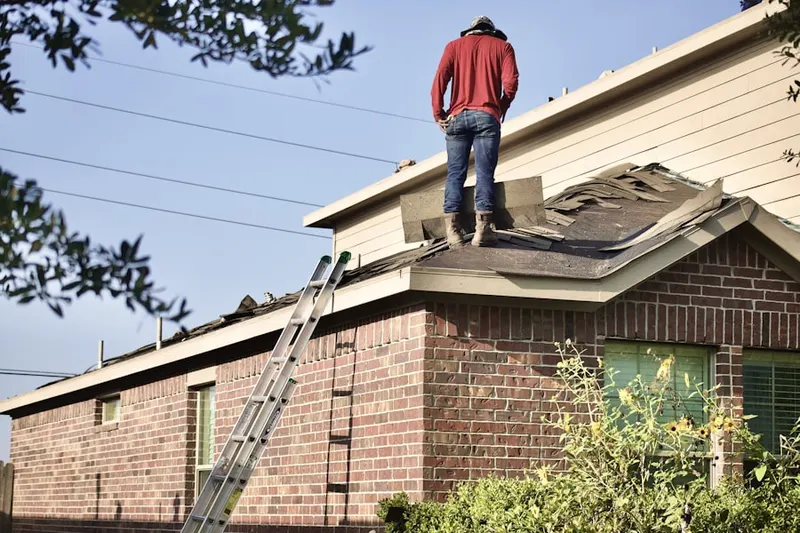 Professional roofer working on a residential roof in Ridgeview Village